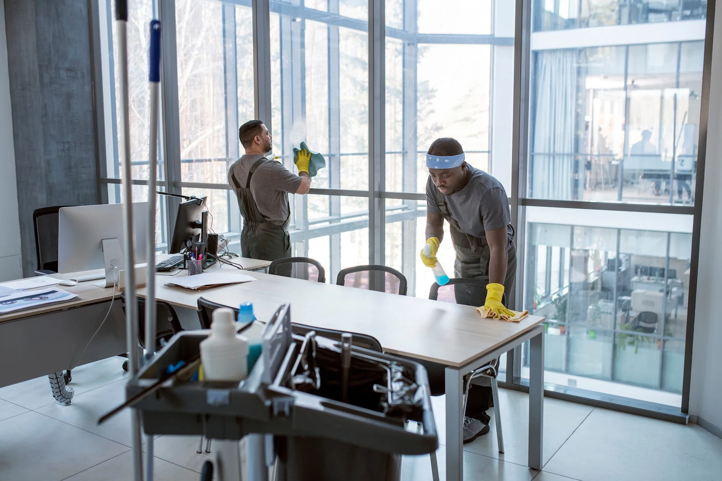 full-shot-men-cleaning-office_23-2149345516