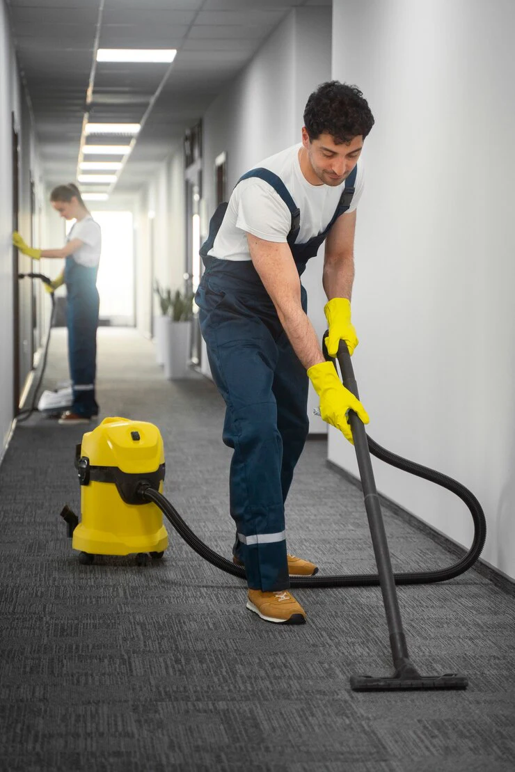full-shot-people-cleaning-building_23-2150454543